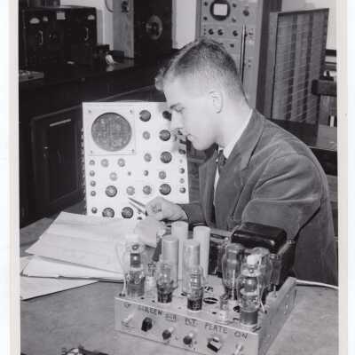 Physics student working in laboratory, November 1958.