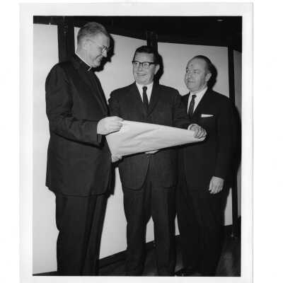 William F. Maloney, S.J., New Jersey Governnor Richard J. Hughes, and Congressman William T. Cahill during alumni communion supper, February 12, 1964.