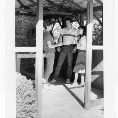 Students talking in old gazebo of Boland Hall.