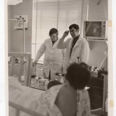 Thomas Dolan and Peter Burghart of Molloy Chemical Society conducting experiments and demonstrations for children who were patients at Children's Hospital of Philadelphia, 1971.