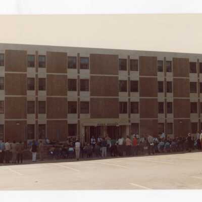 View of guests in front of building at dedication of Sourin Residence Center.