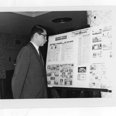 Photo of display of "The Hawk" student newspaper at centennial celebration of LaSalle University.