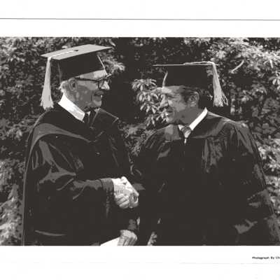 William B. Nixon welcoming honorary degree recipient Joseph J. Saker during 1980 graduation/commencement.