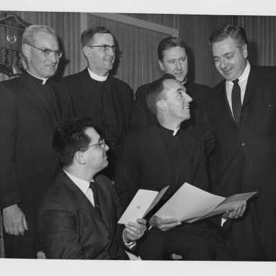Photo of some individuals attending First Annual Institute on Catholic-Jewish relations, including Terrence Toland, S.J., Michael Smith, S.J., Rev. Geroge G. Higgins, and others, March 5-6, 1967.