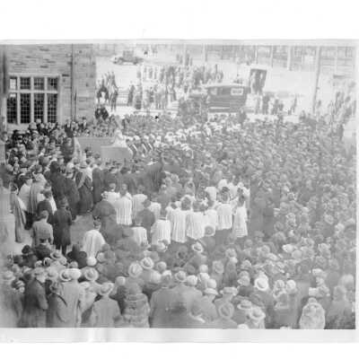 Mass and dedication of Barbelin Hall with Dennis Cardinal Dougherty and crowds in front of building.
