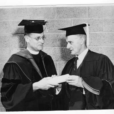 Edward G. Jacklin, S.J. with honorary degree recipient John J. Hearne at 1953 graduation/commencement.