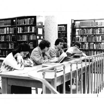 Students studying at desk in Drexel Library.