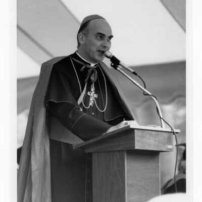 Honorary degree recipient, Bishop John P. Foley, addressing graduates during 1985 graduation/commencement.