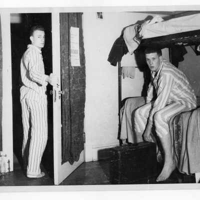 Students from Barry Hall in pajamas in dormitory room.