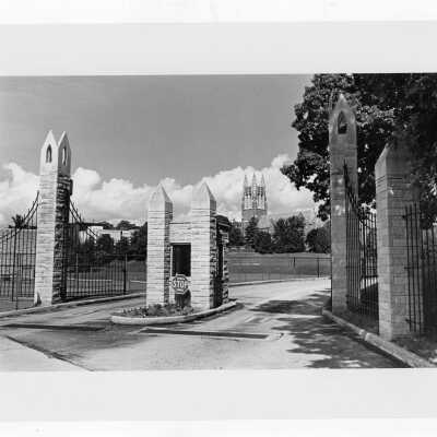 Gate at 54th Street near tennis courts and Barbelin in background.