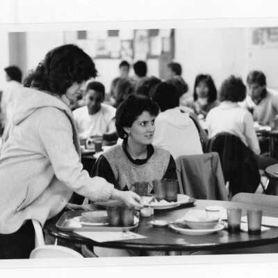 Students eating in cafeteria.