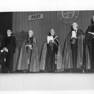 Edward G. Jacklin, S.J., and Bishop Hugh Lamb with honorary degree recipients, John Foster Dulles, Bishop Thomas J. Feeney, S.J., Archbishop Amleto G. Cicognani, during academic convocation, October 28, 1951, as part of centennial celebration.