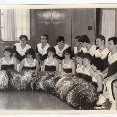 Group photo of men and women cheerleaders.