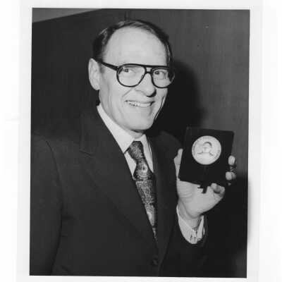 Shaffrey award recipient, Dr. William F. Kellow, holding medal, April 23, 1978.