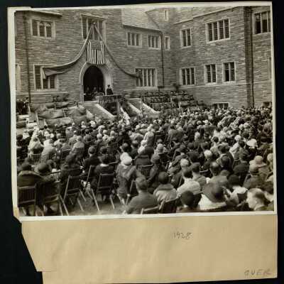 View of honorary degree recipients, F. X. Talbot, S.J., Charles A. Waters, and Rev. William J. Lallou, standing outside Barbelin Hall during 1928 graduation/commencement.