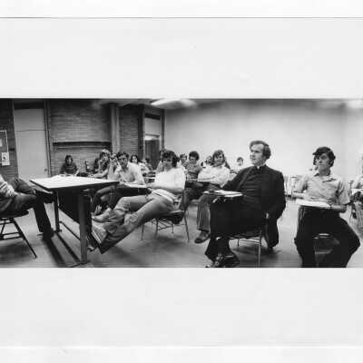 Joseph J. Feeney, S.J.: Faculty, English. In class with students.