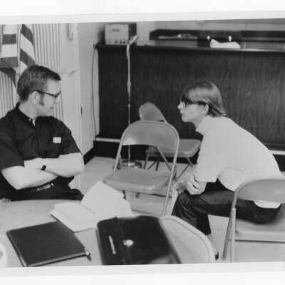 Student, Joseph Forish, and Rev. Francis Cosgrove, Director of Youth Activities in Mississippi, discuss the Peace and Human Development community service/outreach summer project in Mississippi.