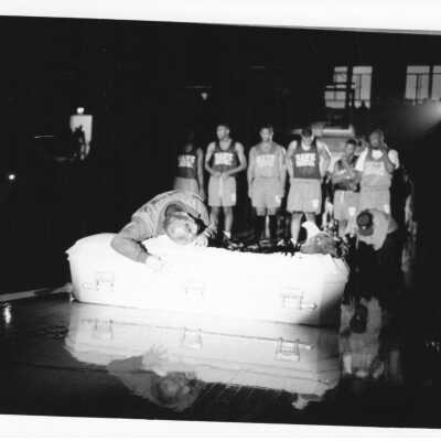 Men's Basketball-Hawk Mascot in coffin at Rally during Midnight Madness