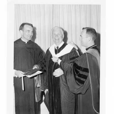 Terrence Toland, S.J., with honorary degree recipients, Avery Dulles,S.J., and Christopher Hollis during 1969 graduation/commencement.