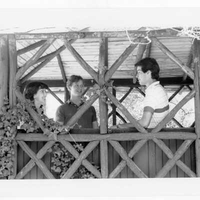 Students talking in old gazebo of Boland Hall.