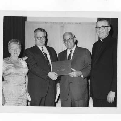 Joseph N. Bartlett, Chemistry Professor, is honored at a dinner for 38 years of service, May 24, 1967, with Mrs. Bartlett, George Beichl, William F. Maloney,S.J.