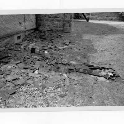Exterior view of debris on ground outside of Simpson Hall after fire.