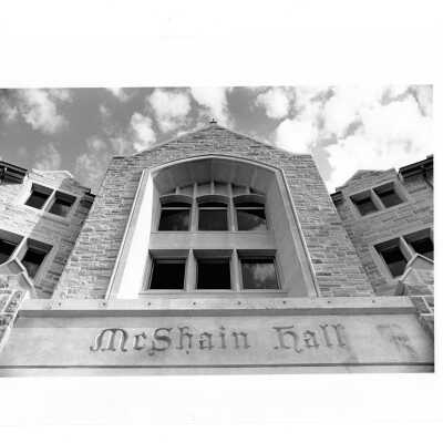 View of front of McShain Hall with inscription of name.