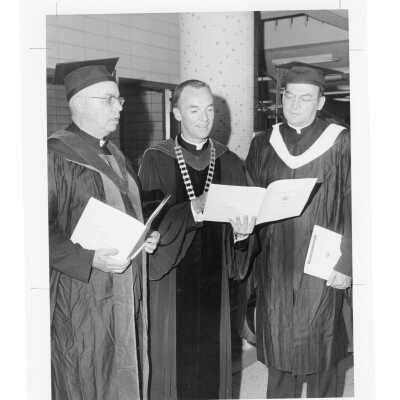 Terrence Toland, S.J., with two recipients of Bene Merenti Medal, Walter J. Handren, S.J., and Francis J. Renz, S.J. during 1969 graduation/commencement.