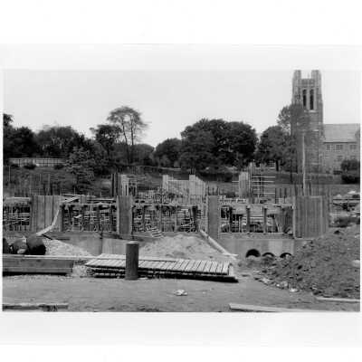 Exterior view of Bellarmine during early construction with Barbelin Tower in background.