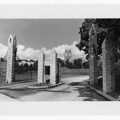 Gate at 54th Street near tennis courts and Barbelin in background.