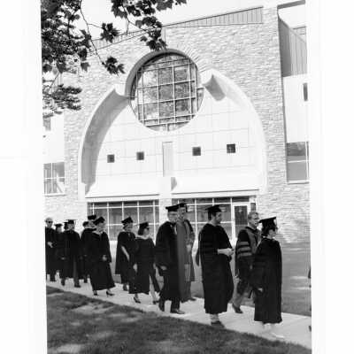 Faculty members processing in front of chapel during 1993 graduation/commencement.