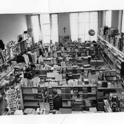 Interior view of bookstore with students shopping.