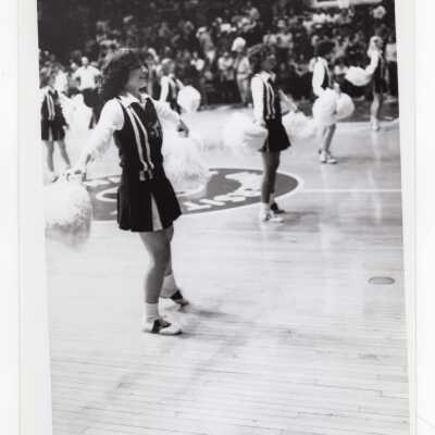 Women cheerleaders at basketball game.