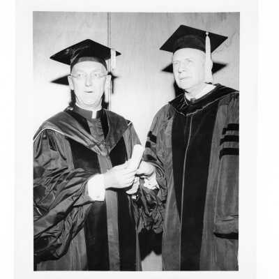 J. Joseph Bluett, S.J., with honorary degree recipient during 1959 graduation/commencement.