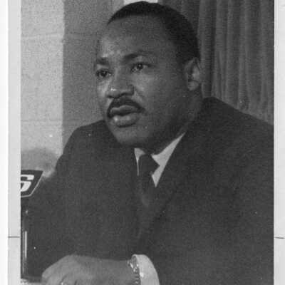 Dr. Martin Luther King, Jr. being interviewed in press conference while visiting Saint Joseph's College, October 26, 1967 to deliver speech in Field House.