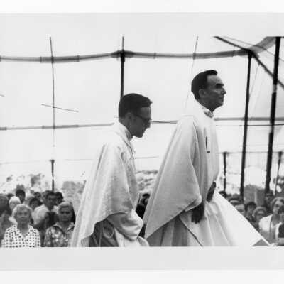 Terrence Toland, S.J., and Donald I. MacLean, S.J. at mass held July 31, 1976, on Gest Lawn prior to academic convocation during SJC 125th anniversary celebration.