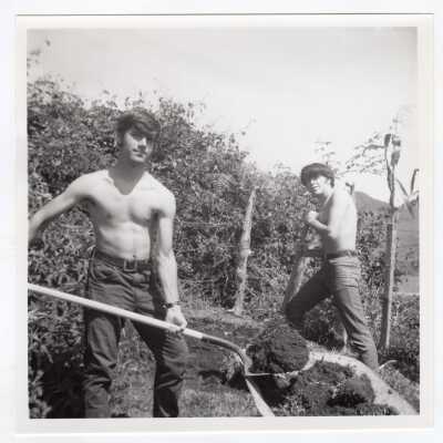 Two students working in field in Colombia during Latin American Studies Institute Summer Service Project, summer 1970.