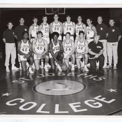 Men's Basketball Team with coaches.