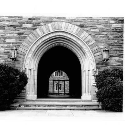 Exterior view central arch at main entrance to Barbelin building off City Avenue.