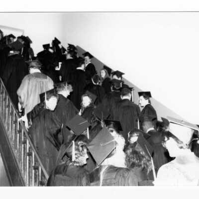 Graduating students climbing stairwell to Convention Hall, Philadelphia Civic Center during 1990 graduation/commencement.