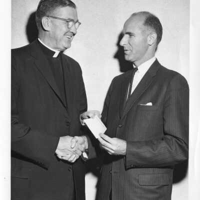 William F. Maloney, S.J., with another individual, November 23, 1962.