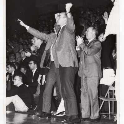 Men's Basketball Coach Jack Ramsay and crowd, cheering at game.