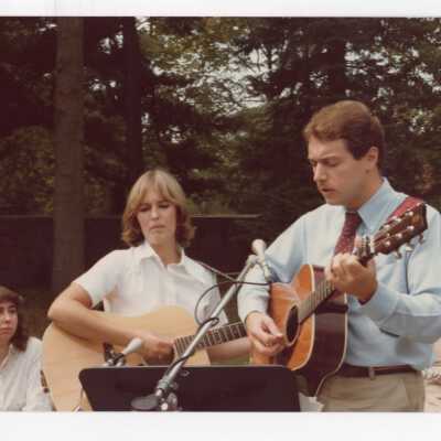Students playing guitars at dedication of Sourin Residence Center.