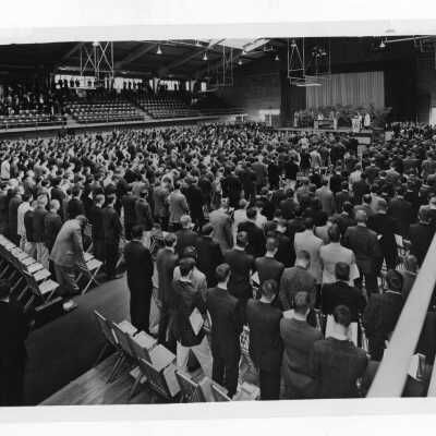 Students attending Mass in Field House.