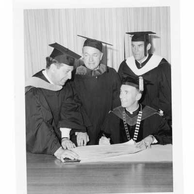 Terrence Toland, S.J., with three honorary degree recipients, Fred Hechinger, William T. Cahill, and Louis C. Fischer during 1970 graduation/commencement.