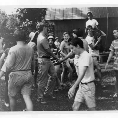 Students with children on playground as part of Mississippi summer project, a community service/outreach program (?)