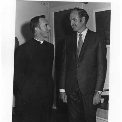 Senator George McGovern talking with Terrence Toland, S.J., during visit to campus to deliver speech, October 2, 1969..