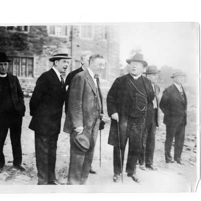 Joseph C. Trainer, Dennis Cardinal Dougherty and others discussing Barbelin building at new site for college on City Avenue in Overbrook.