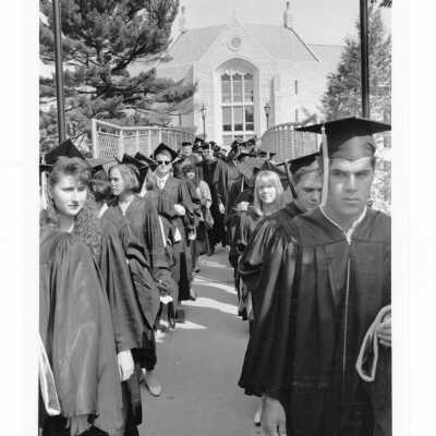 Graduating students processing across McShain pedestrian bridge to Gest Lawn for 1993 graduation/commencement ceremony.
