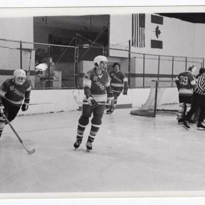 Men's ice hockey team in game.